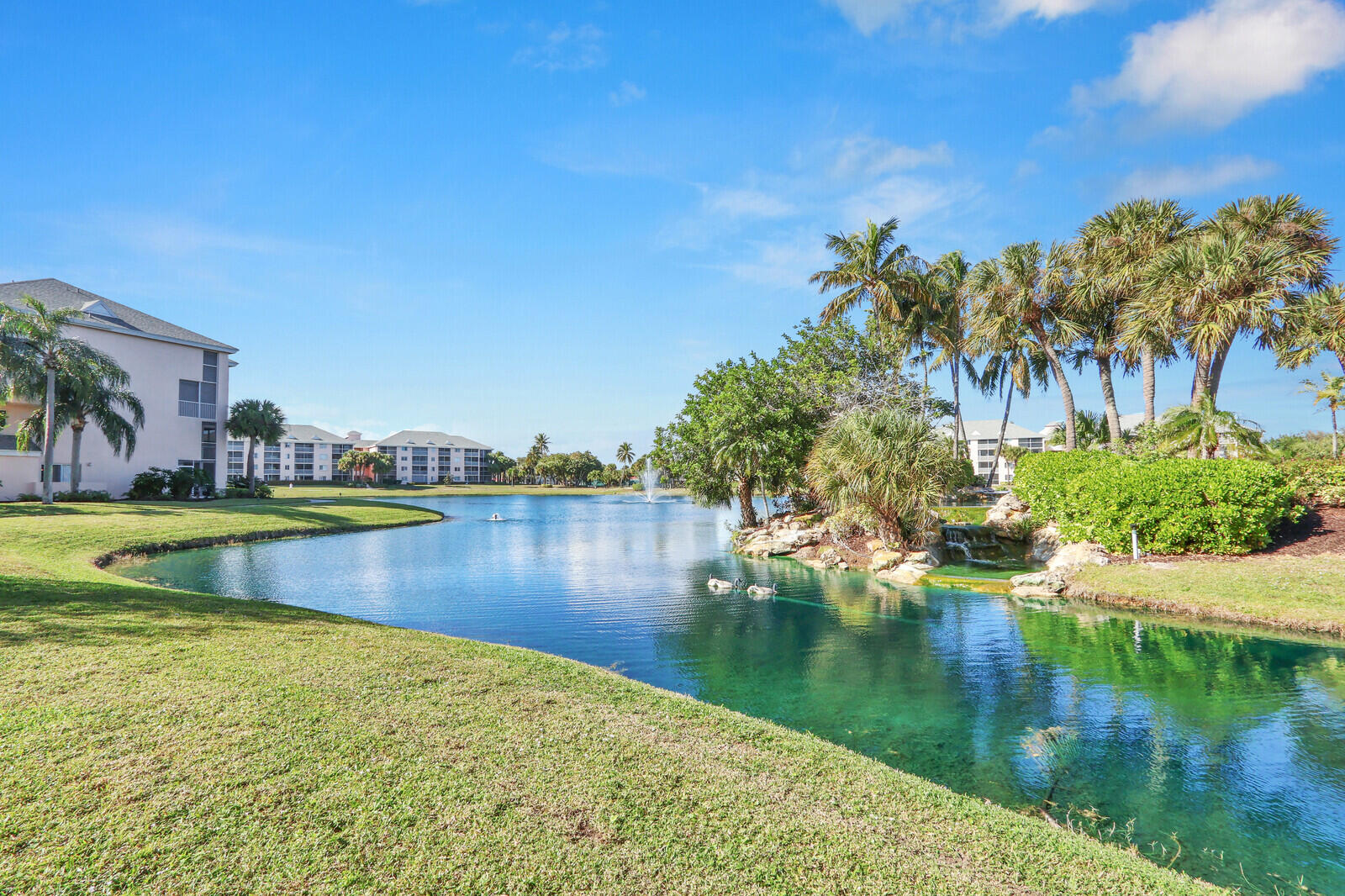 353 Highway 1, Unit D105 Jupiter, FL 33477 - Photo 48 of 56 a view of a lake with houses