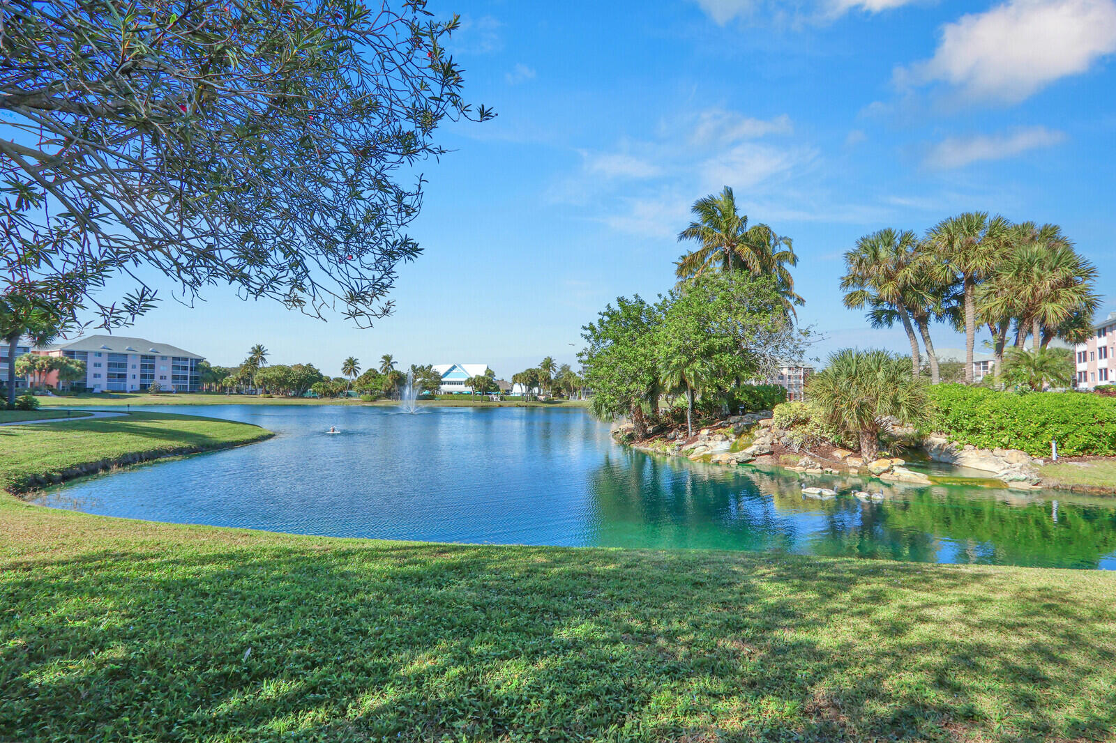 353 Highway 1, Unit D105 Jupiter, FL 33477 - Photo 50 of 56 a view of a lake with houses in the background