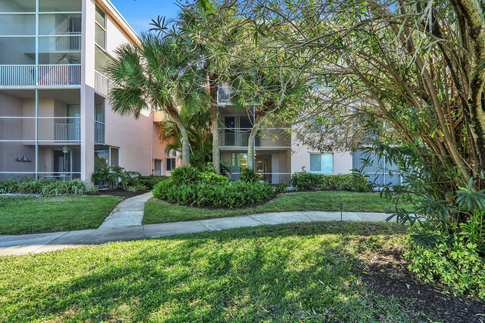 353 Highway 1, Unit D105 Jupiter, FL 33477 - Photo 51 of 56 a front view of a house with garden