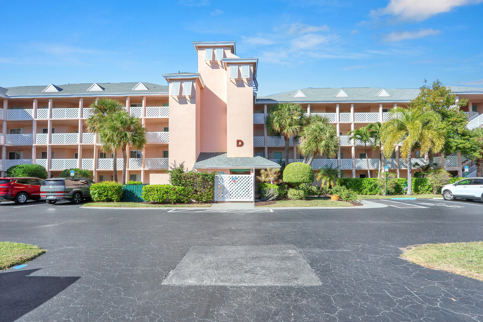 353 Highway 1, Unit D105 Jupiter, FL 33477 - Photo 53 of 56 a front view of a building with garden