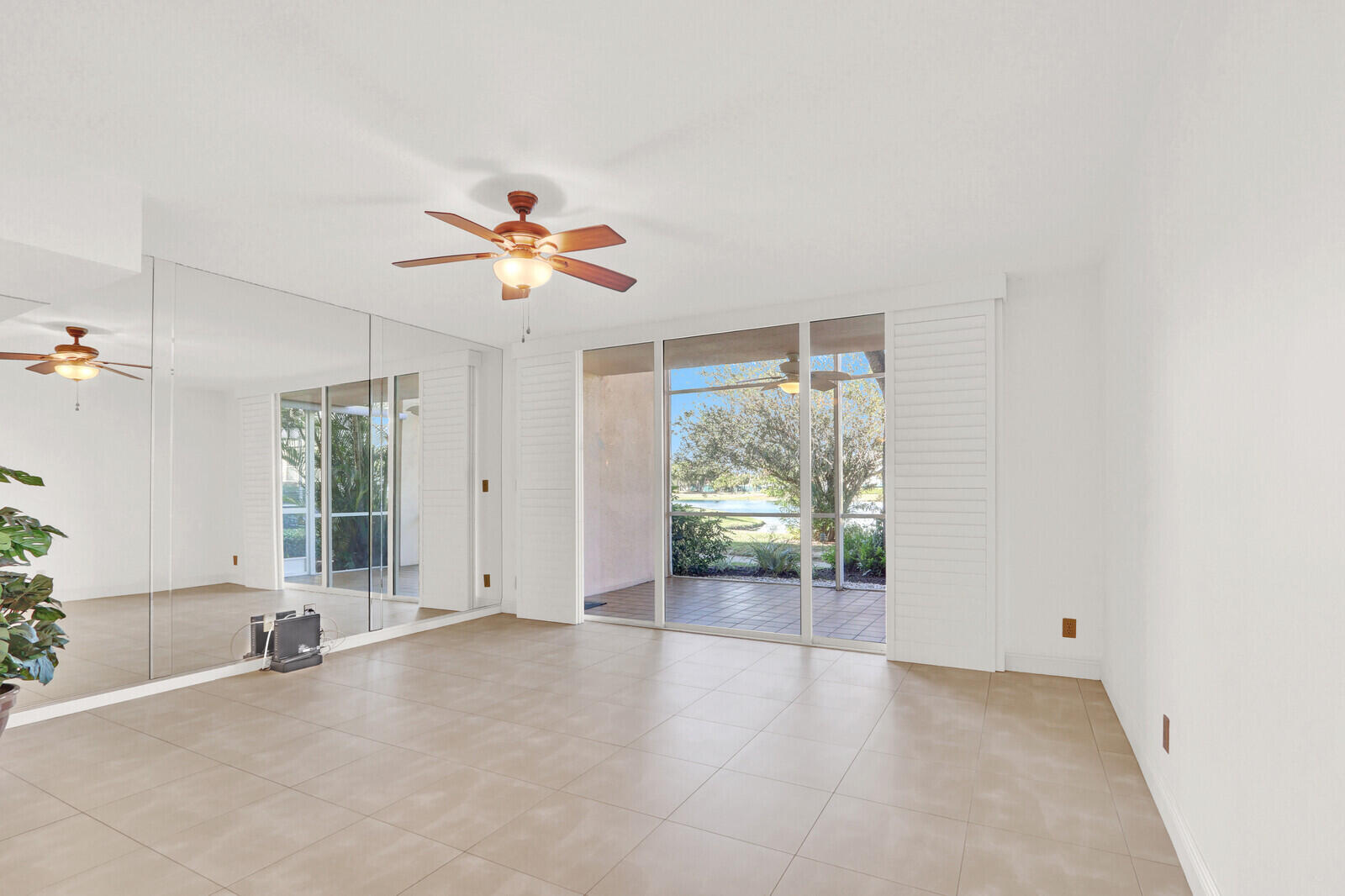 353 Highway 1, Unit D105 Jupiter, FL 33477 - Photo 7 of 56 an empty room with windows and fan