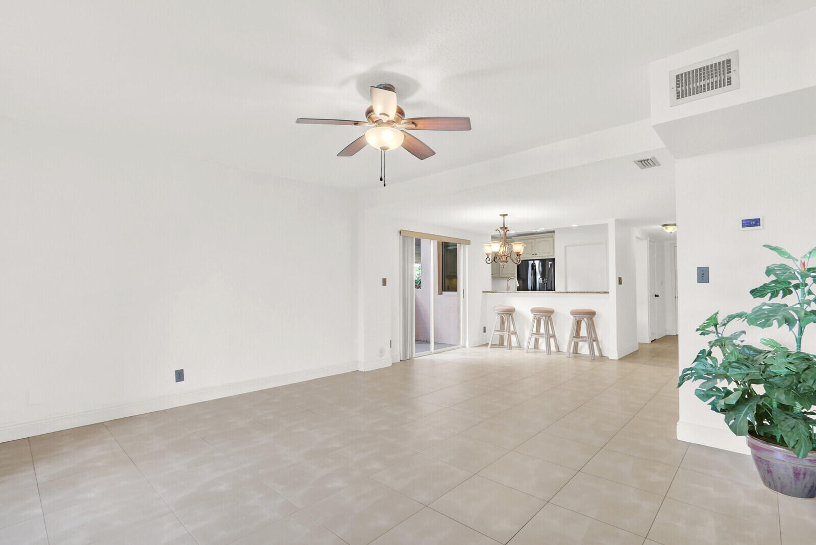 353 Highway 1, Unit D105 Jupiter, FL 33477 - Photo 9 of 56 a view of a livingroom with a ceiling fan