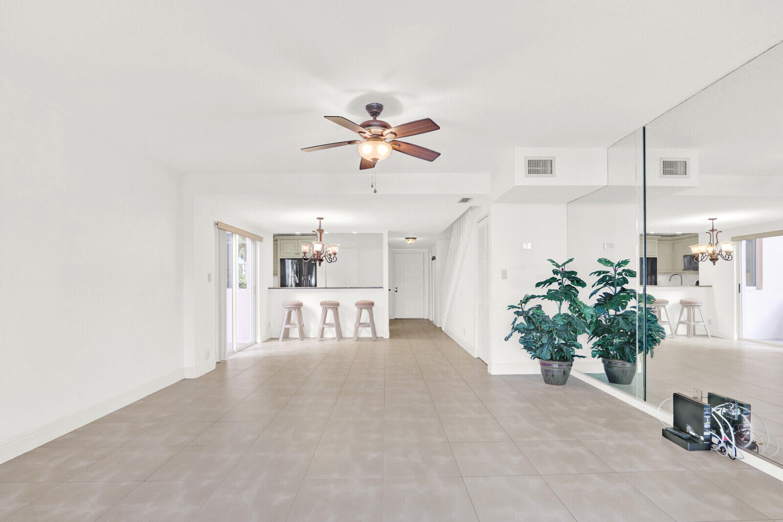 353 Highway 1, Unit D105 Jupiter, FL 33477 - Photo 10 of 56 a view of living room with furniture and a chandelier