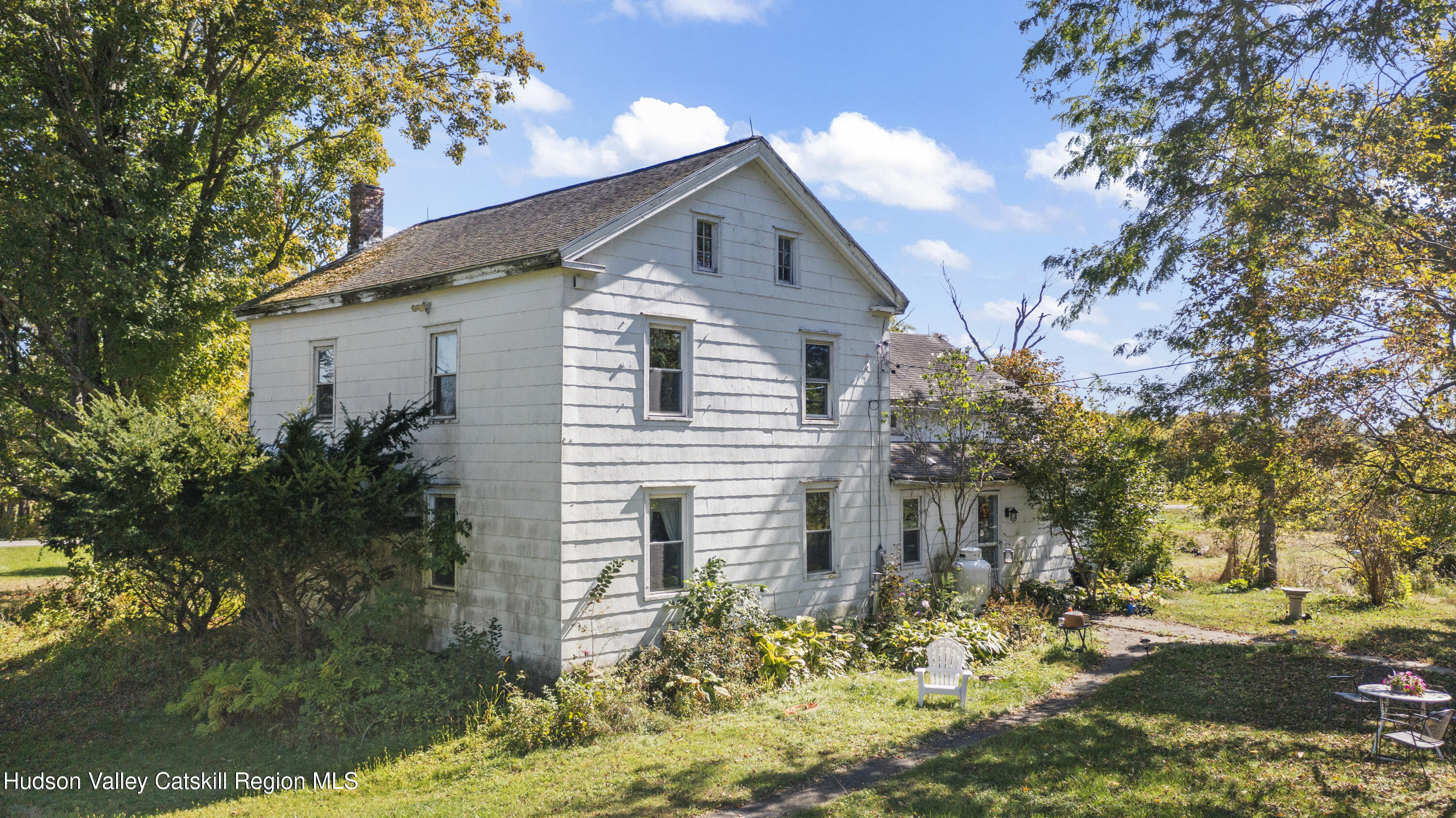 1745 County Route 7 Ancram, NY 12502 - Photo 2 of 22 a front view of a house with a yard