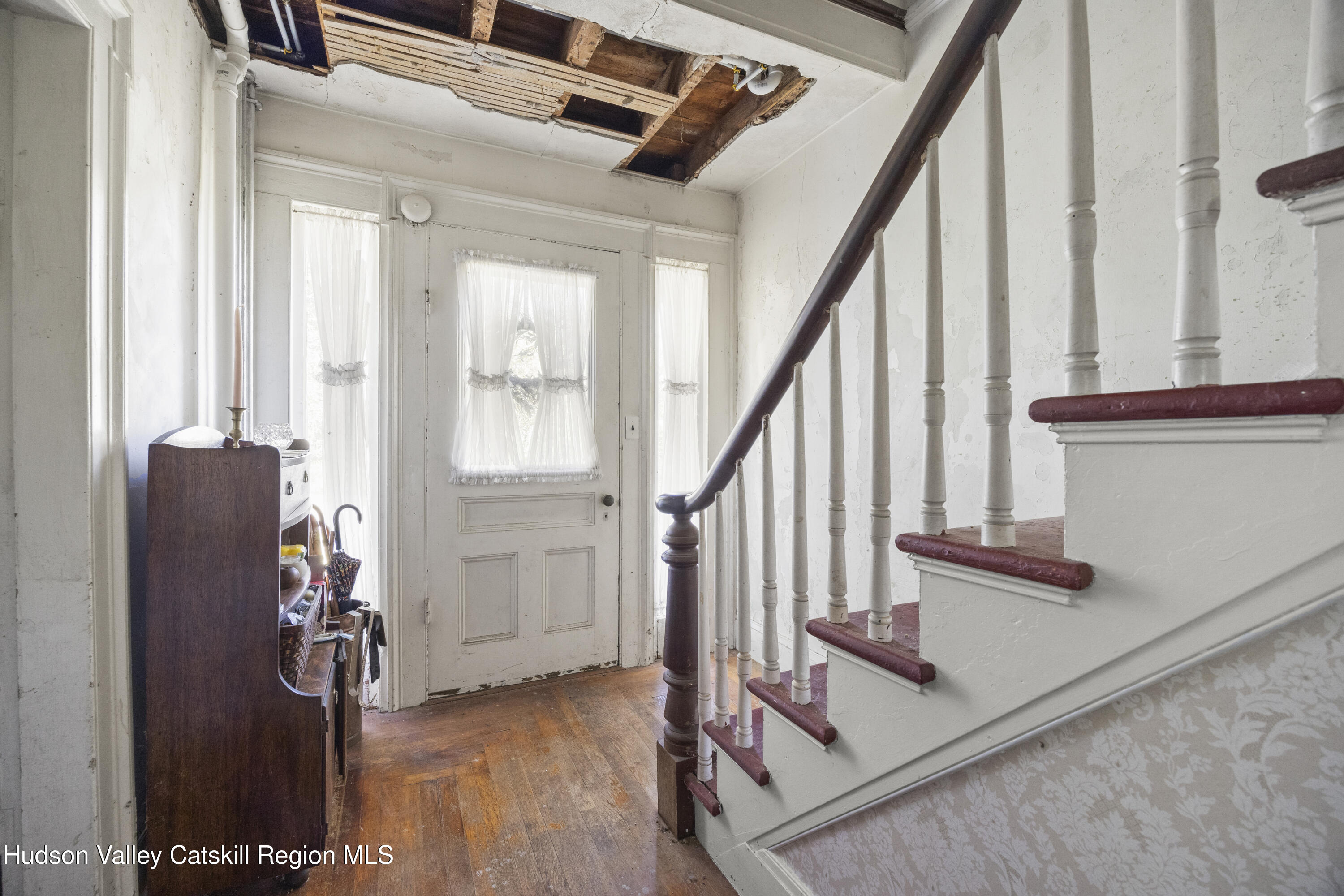 1745 County Route 7 Ancram, NY 12502 - Photo 10 of 22 a view of entryway with wooden floor and stairs