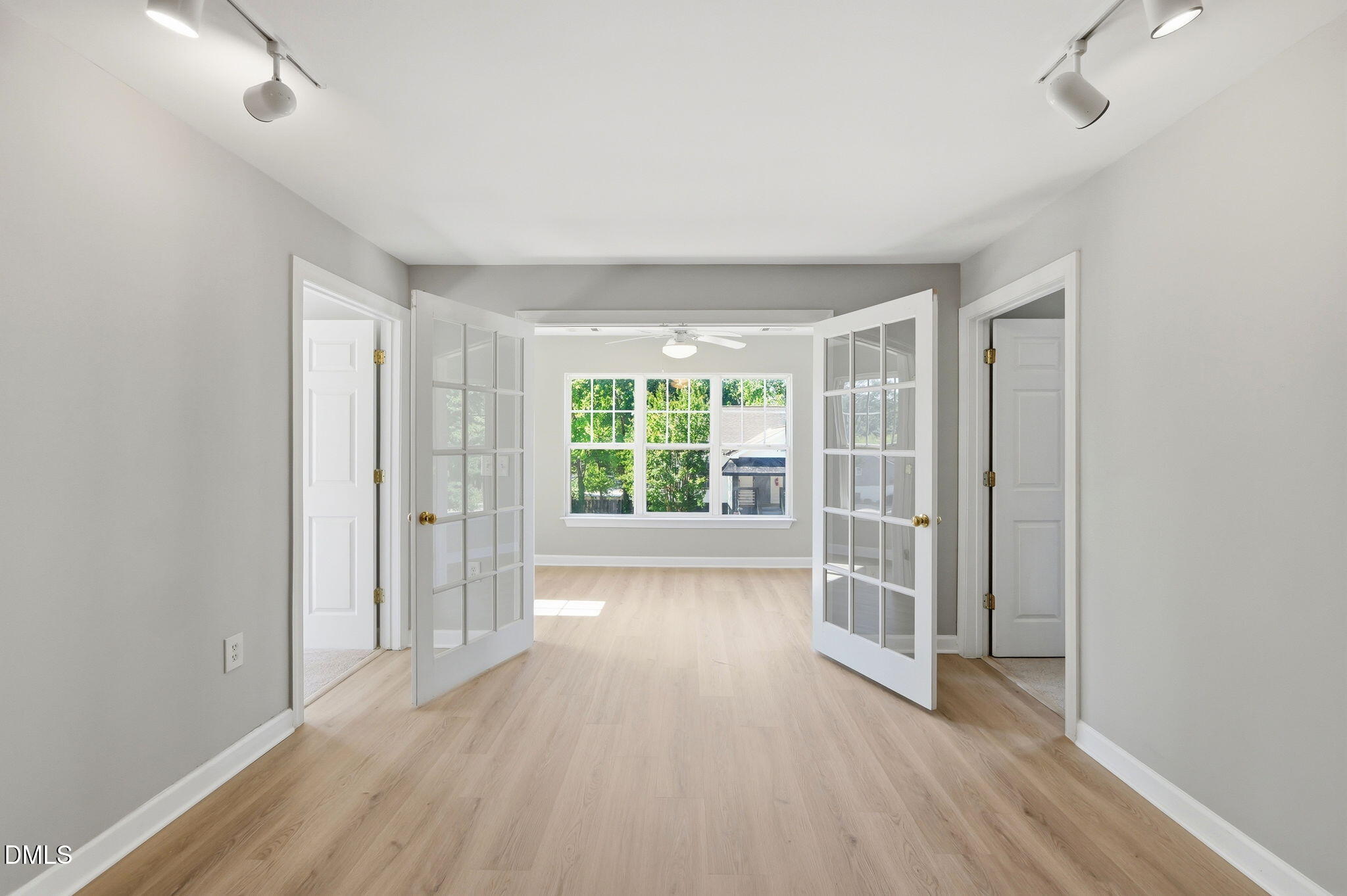 929 Morreene Road, Unit A23 Durham, NC 27705 - Photo 2 of 41 an empty room with wooden floor and windows