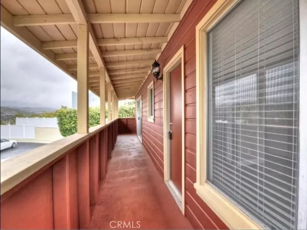 a view of balcony with a potted plant