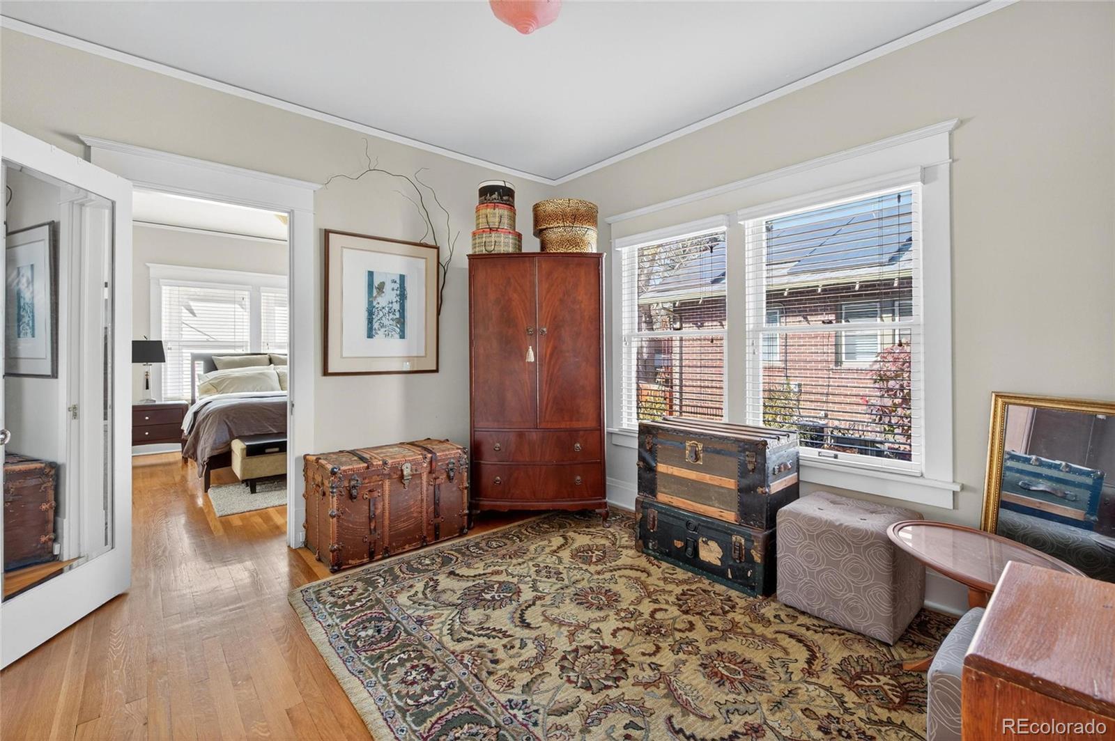 607 Madison Street Denver, CO 80206 - Photo 12 of 31 a bedroom with furniture and a window
