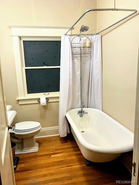 607 Madison Street Denver, CO 80206 - Photo 17 of 31 a bathroom with a sink and a mirror