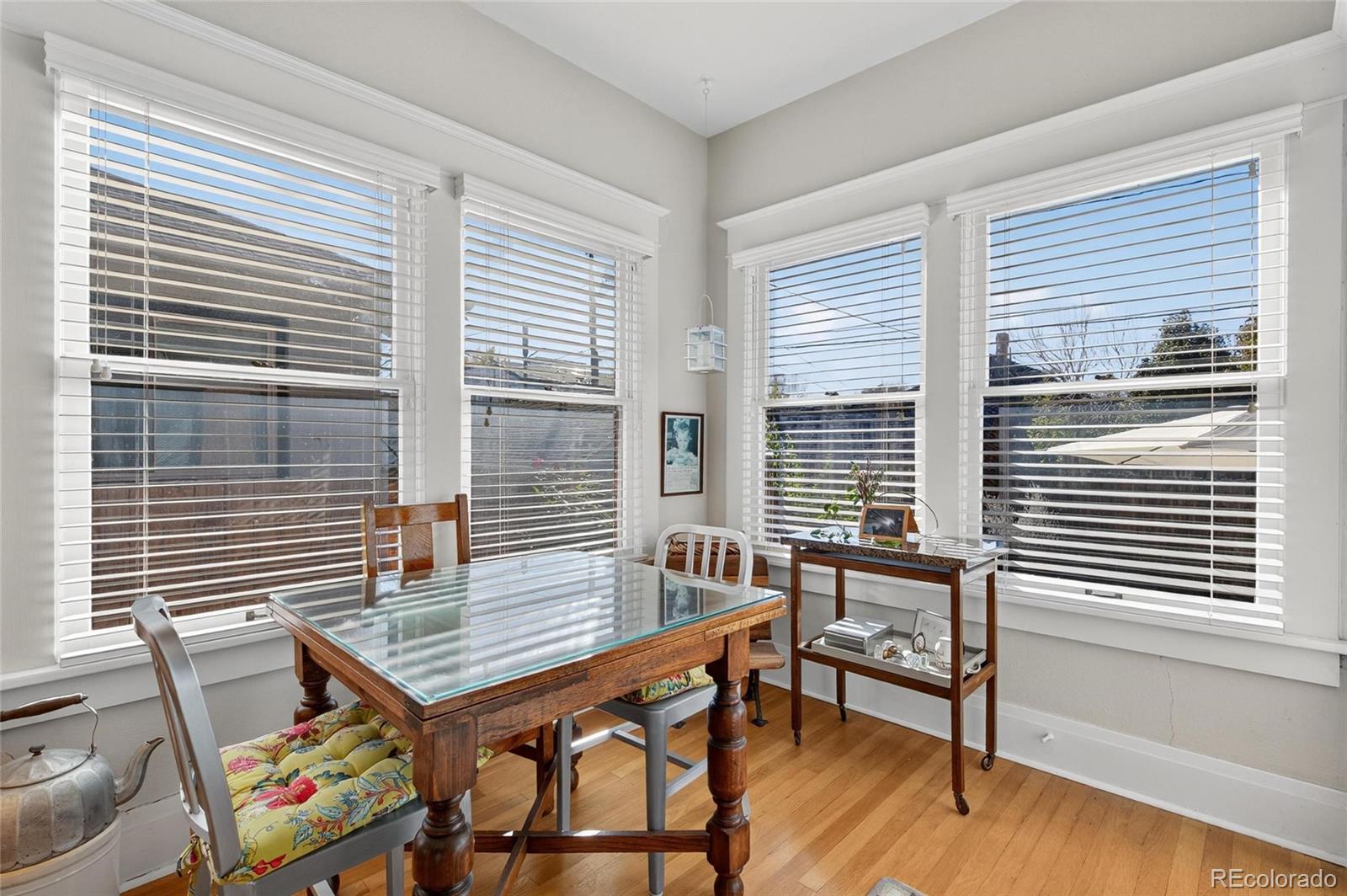 607 Madison Street Denver, CO 80206 - Photo 18 of 31 a view of a workspace with furniture and a window