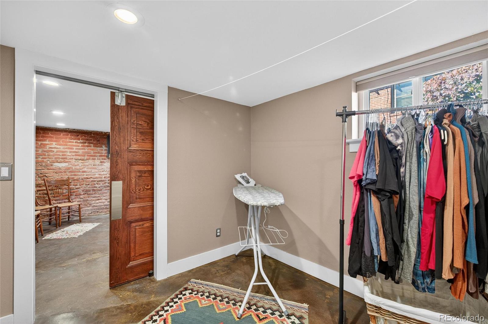 607 Madison Street Denver, CO 80206 - Photo 24 of 31 a view of a room with clothes and shoes