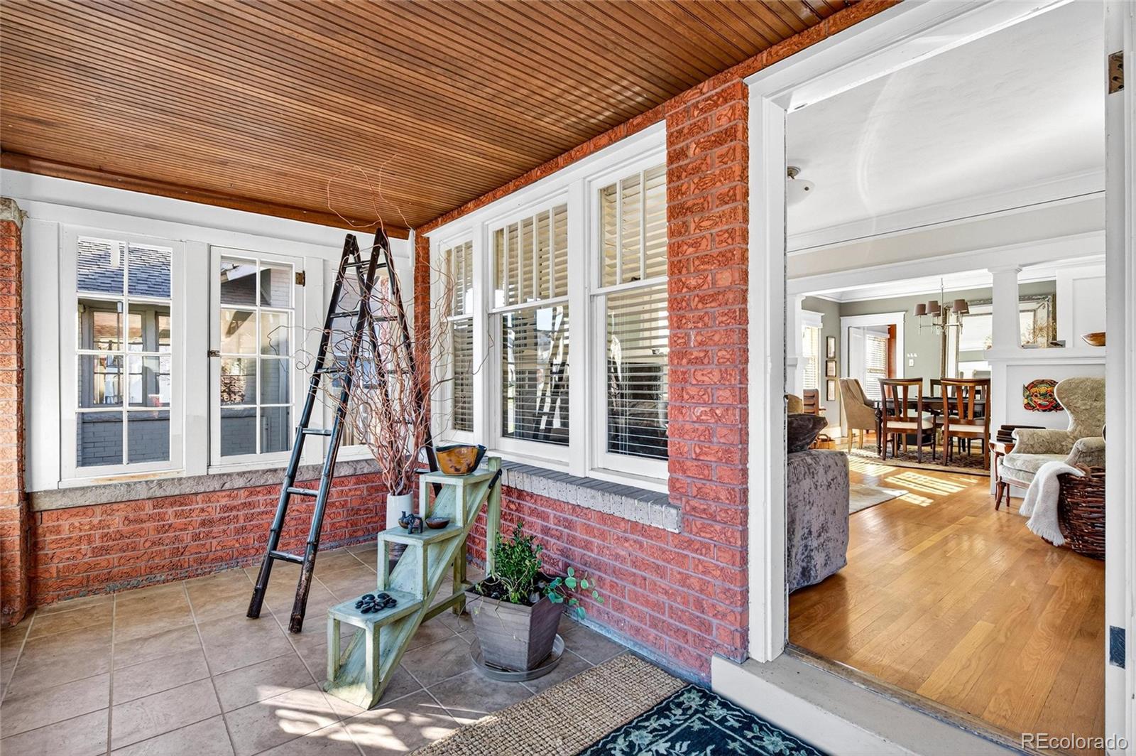 607 Madison Street Denver, CO 80206 - Photo 3 of 31 a front view of a house with outdoor seating