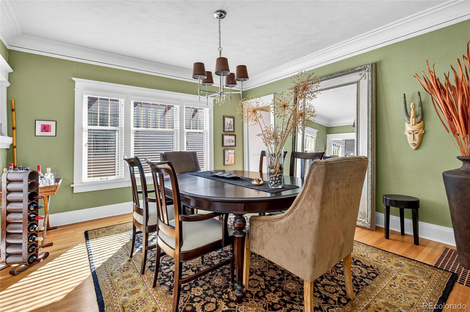 607 Madison Street Denver, CO 80206 - Photo 6 of 31 a view of a dining room with furniture window and wooden floor