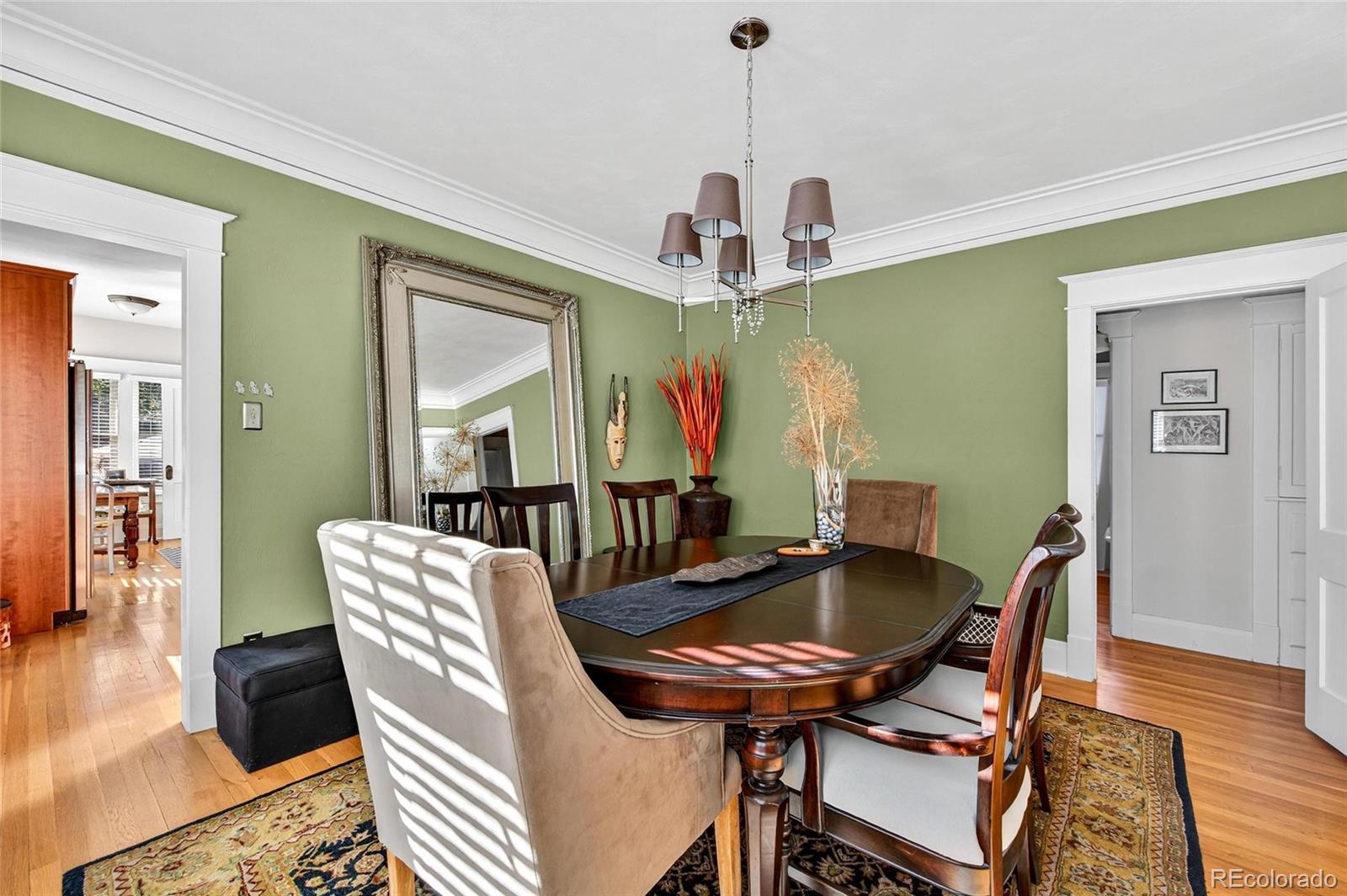 607 Madison Street Denver, CO 80206 - Photo 7 of 31 a view of a dining room with furniture window and wooden floor