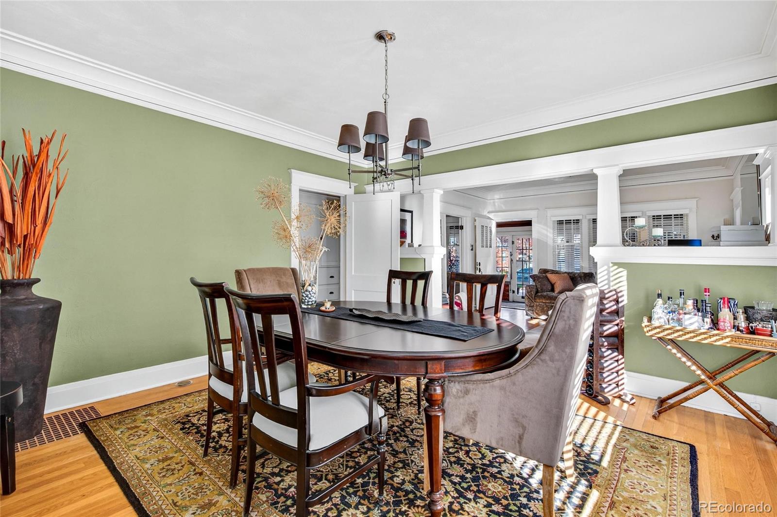 607 Madison Street Denver, CO 80206 - Photo 8 of 31 a view of a dining room with furniture and wooden floor