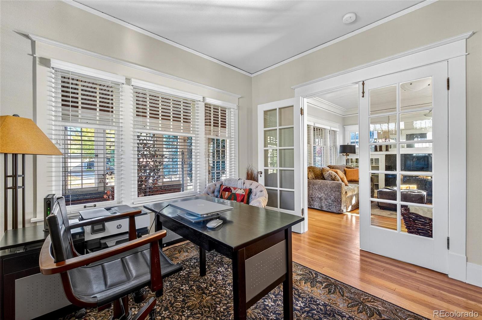 607 Madison Street Denver, CO 80206 - Photo 9 of 31 a living room with furniture and a window