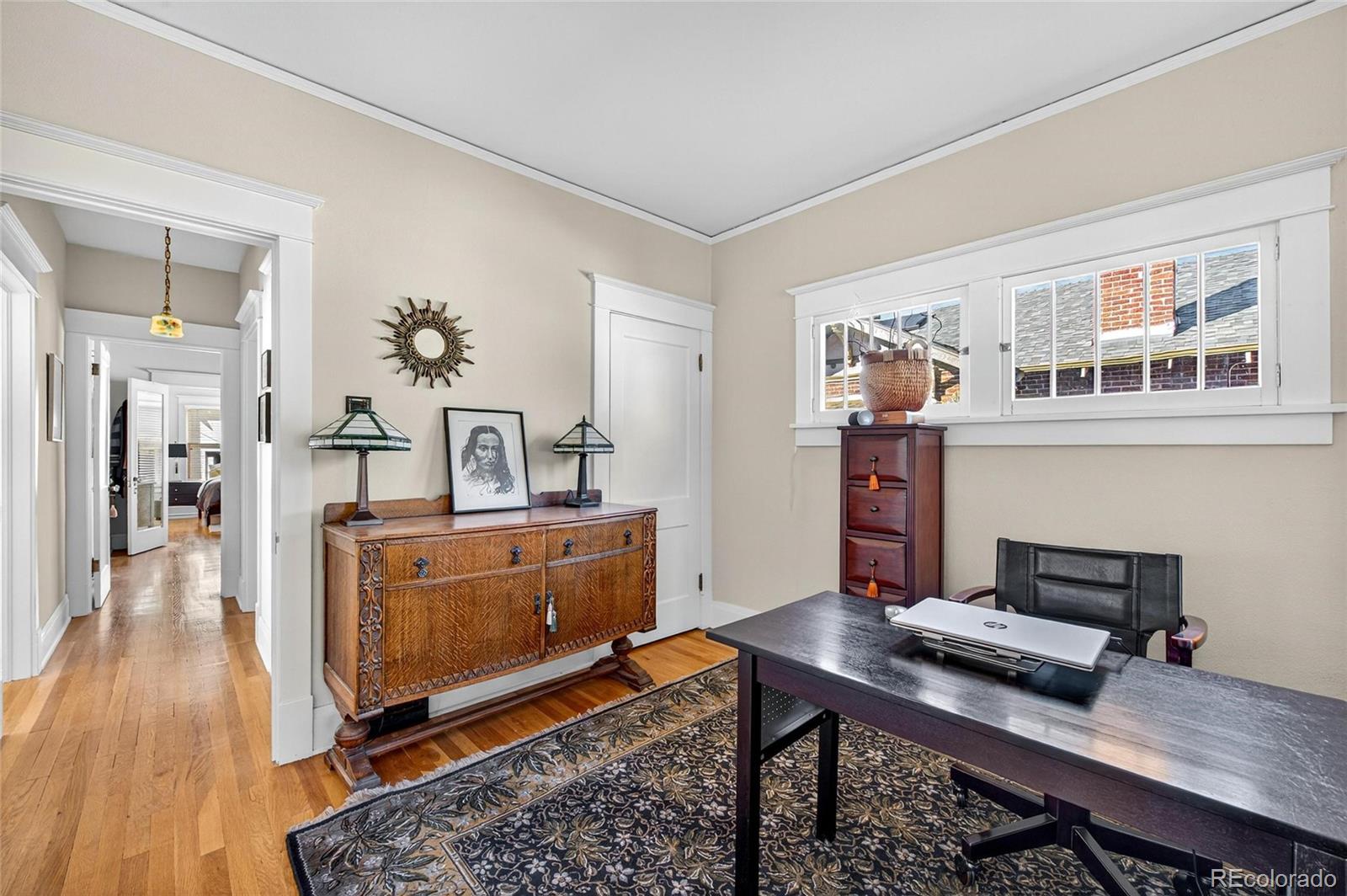 607 Madison Street Denver, CO 80206 - Photo 10 of 31 a workspace with furniture and window