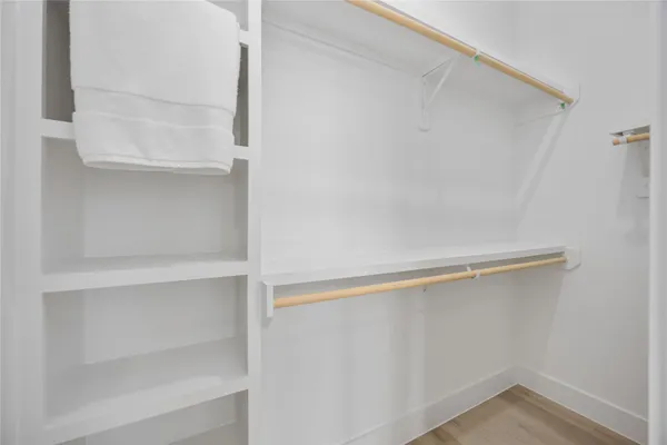 a view of an empty walk in closet