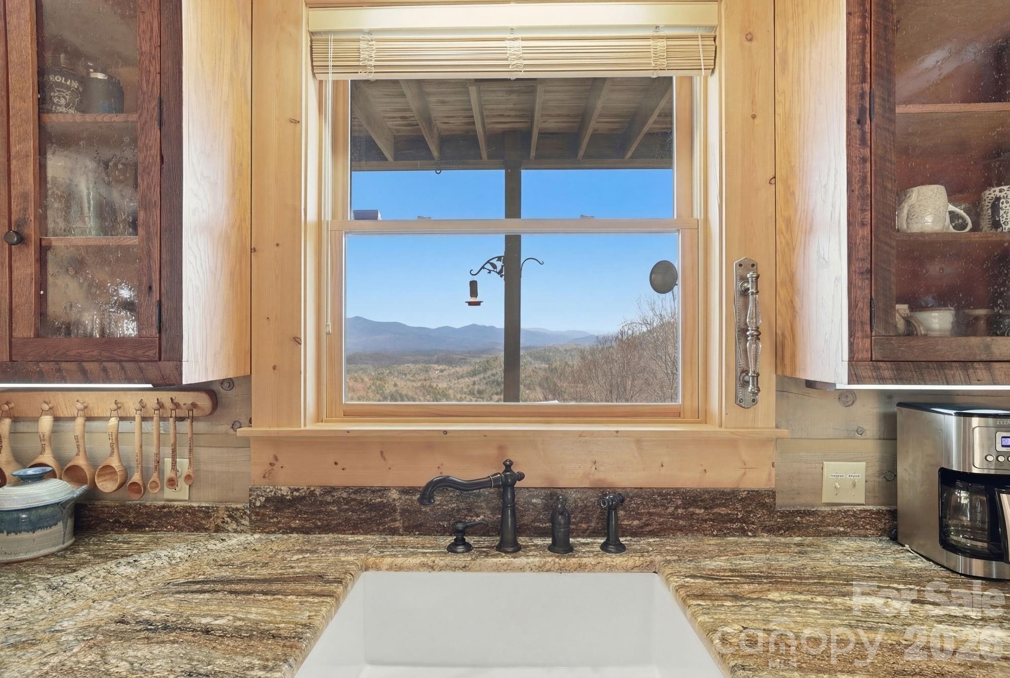 2150 Shell Stand Road Almond, NC 28702 - Photo 11 of 42 a bathroom with a granite countertop tub and shower
