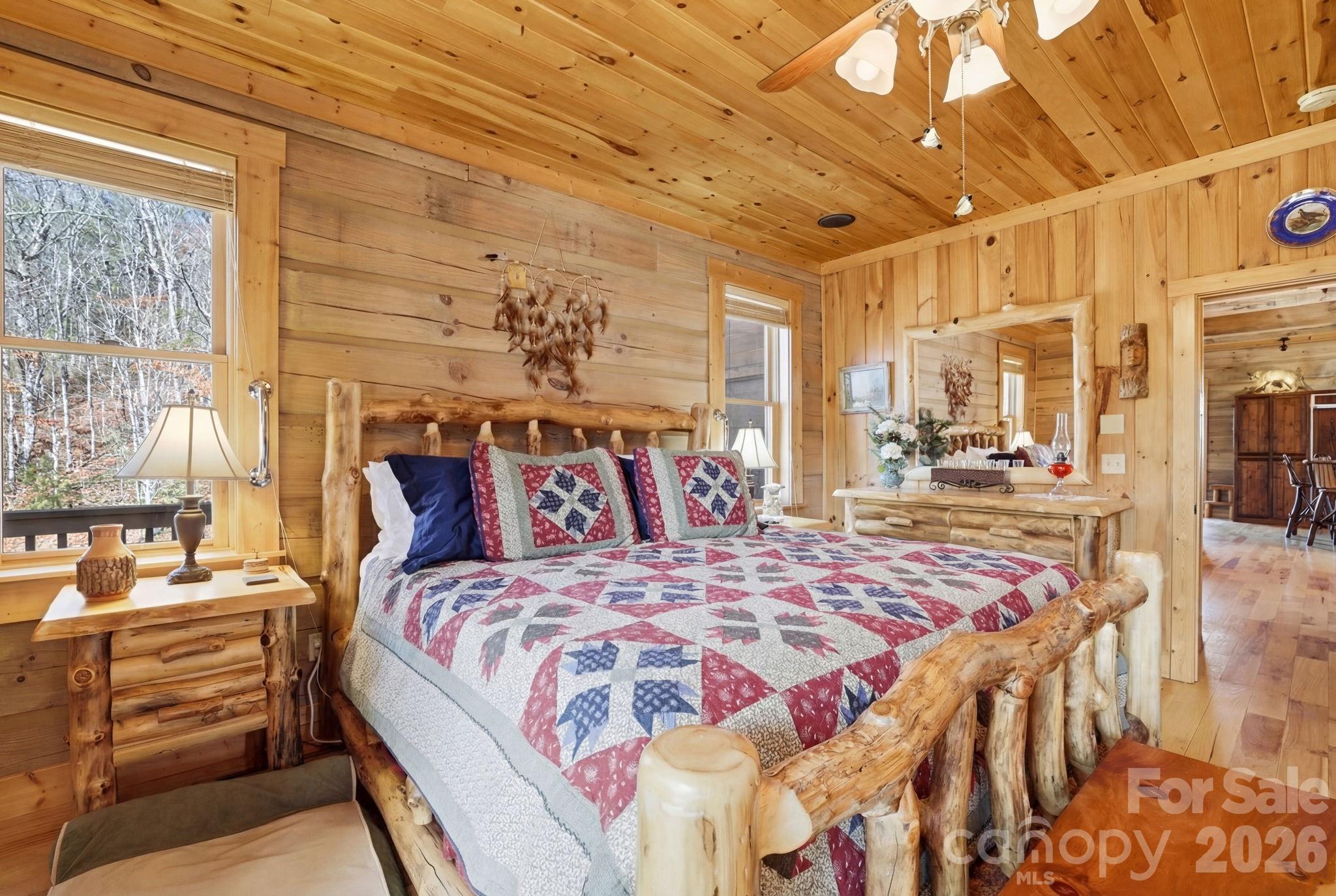 2150 Shell Stand Road Almond, NC 28702 - Photo 21 of 42 a bedroom with a bed and a window
