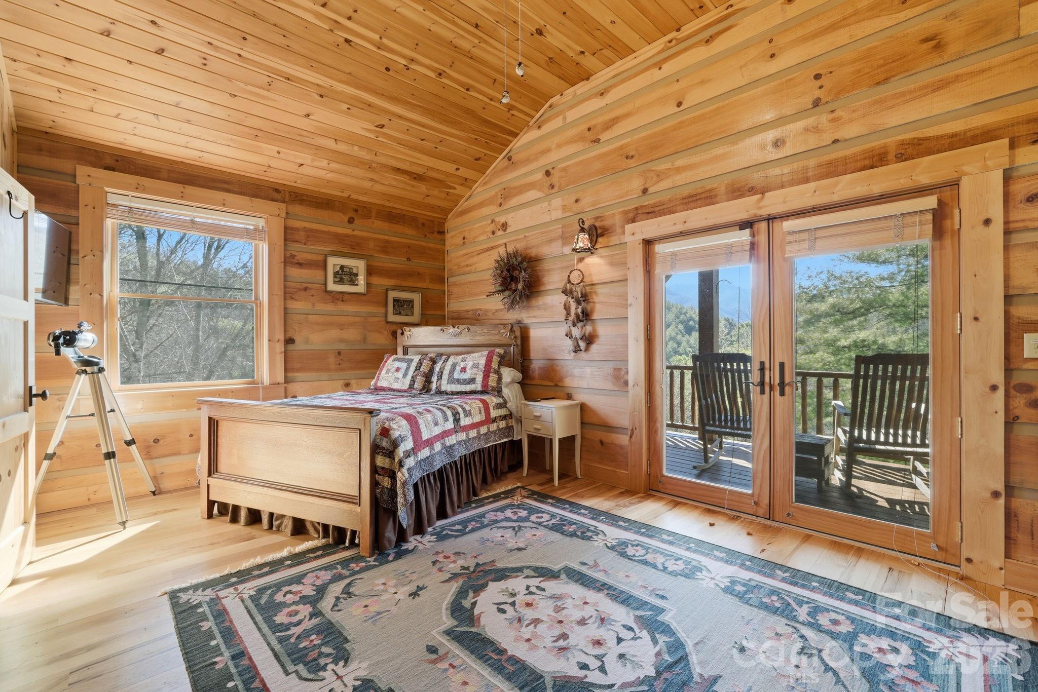 2150 Shell Stand Road Almond, NC 28702 - Photo 30 of 42 a bed room with a bed and a window