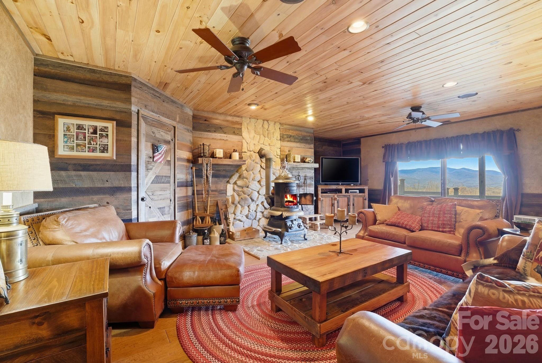 2150 Shell Stand Road Almond, NC 28702 - Photo 31 of 42 a living room with furniture and a wooden floor
