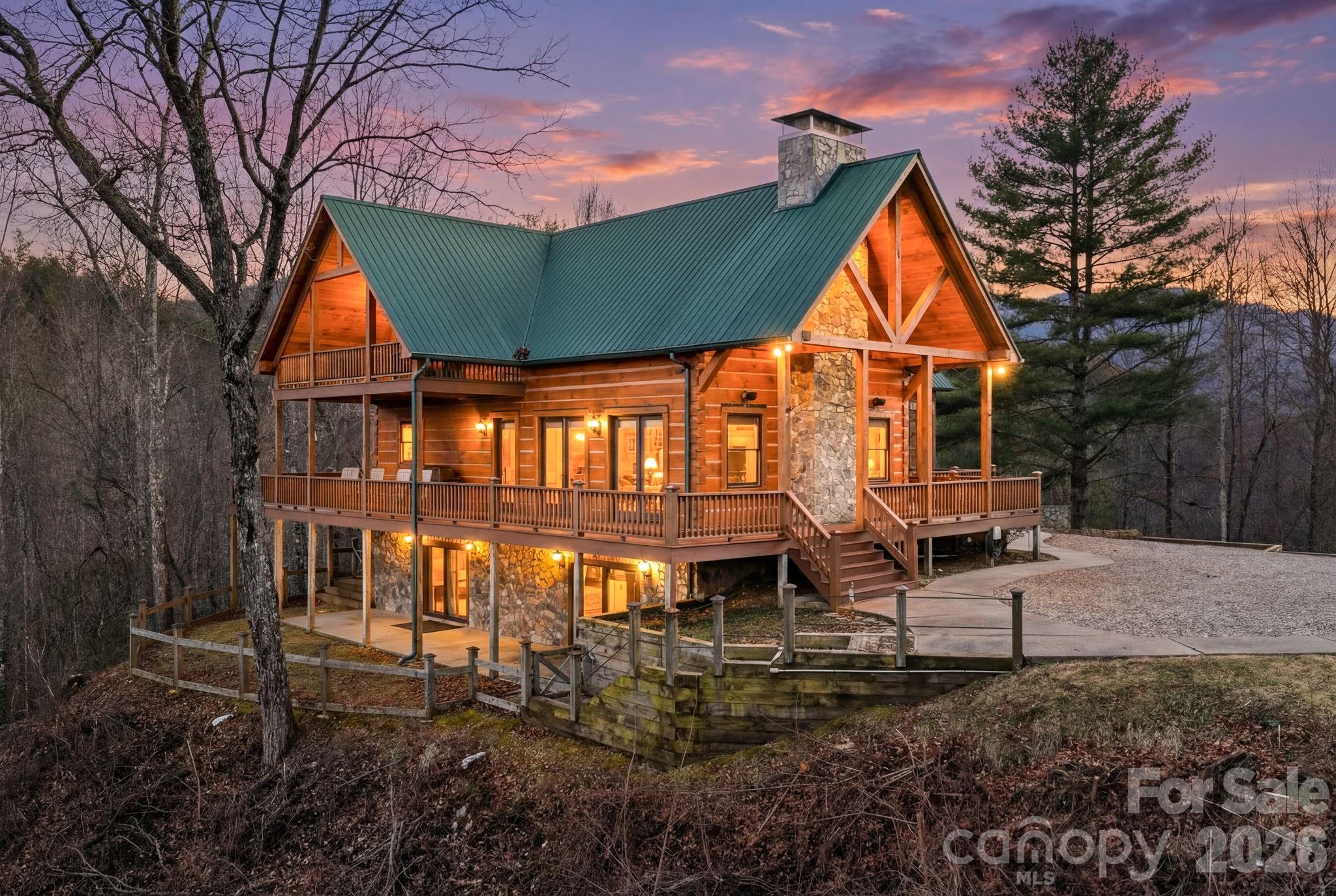 2150 Shell Stand Road Almond, NC 28702 - Photo 41 of 42 a view of house with backyard and outdoor seating