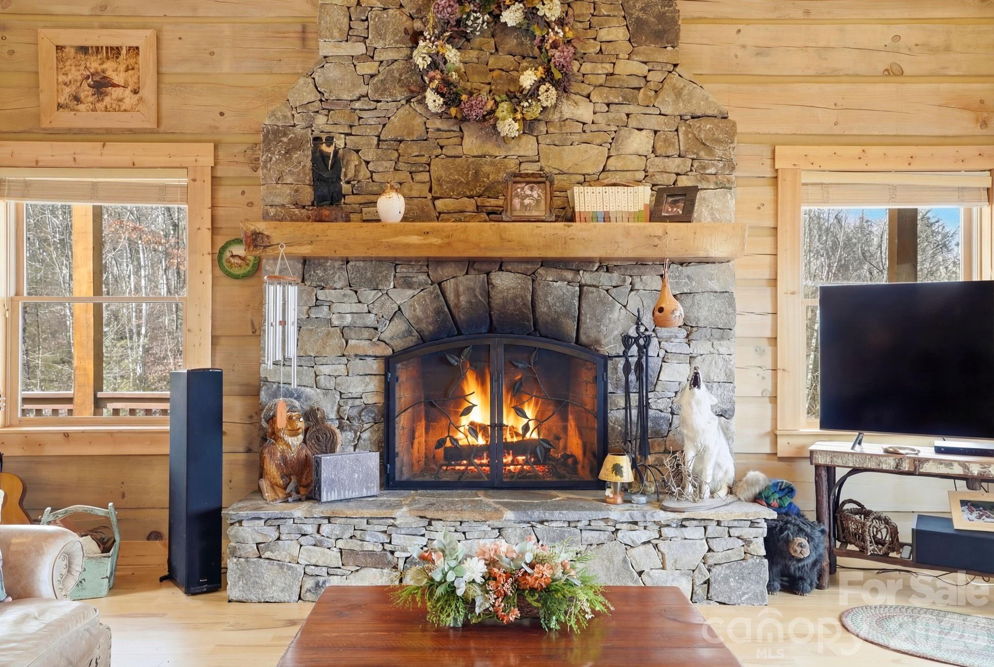 2150 Shell Stand Road Almond, NC 28702 - Photo 6 of 42 a living room with fireplace furniture and a flat screen tv