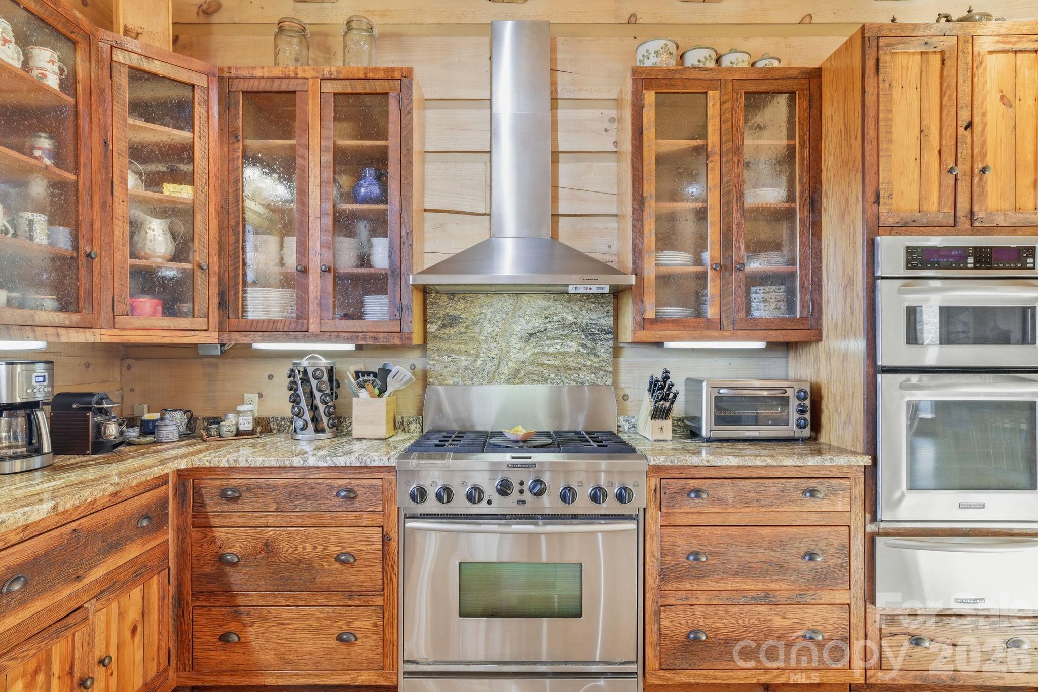 2150 Shell Stand Road Almond, NC 28702 - Photo 10 of 42 a kitchen with stainless steel appliances granite countertop a stove and a sink