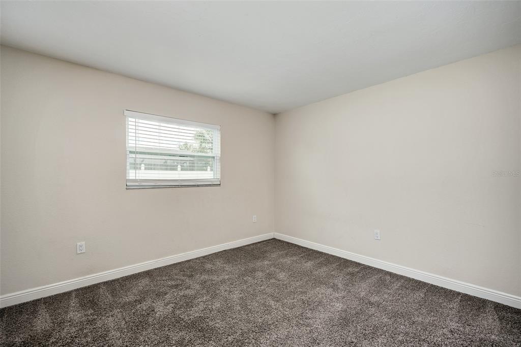 1330 Georgetowne Circle Sarasota, FL 34232 - Photo 34 of 46 an empty room with a window