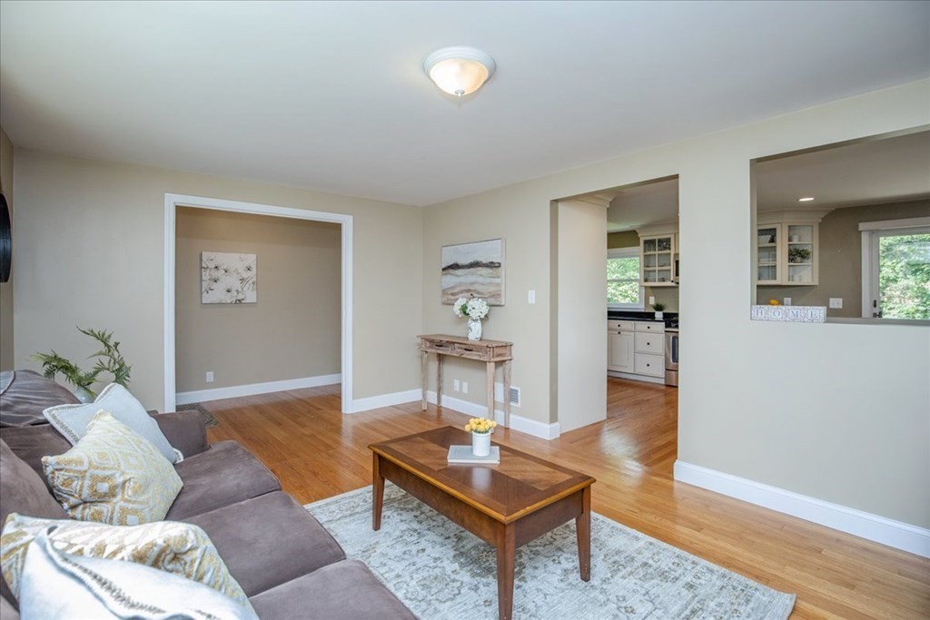 22 Lantern Lane Burlington, MA 01803 - Photo 13 of 34 a living room with furniture and wooden floor