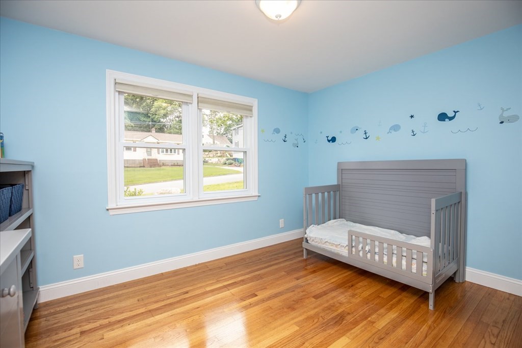 22 Lantern Lane Burlington, MA 01803 - Photo 21 of 34 a bedroom with a bed and a window