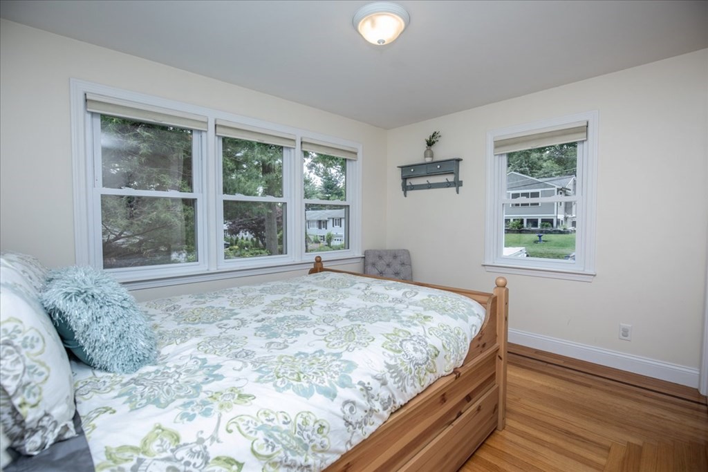 22 Lantern Lane Burlington, MA 01803 - Photo 22 of 34 a bed sitting in a bedroom next to a window