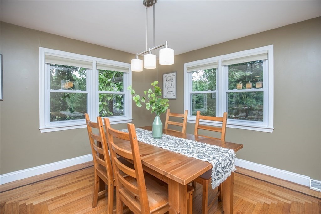 22 Lantern Lane Burlington, MA 01803 - Photo 8 of 34 a dining room with furniture a chandelier and wooden floor
