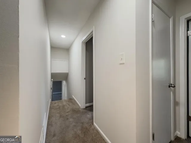 a view of hallway with livingroom