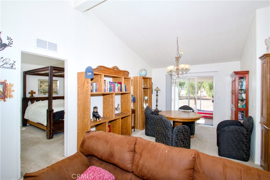 4742 Avenida La Mirada Joshua Tree, CA 92252 - Photo 13 of 45 a living room with furniture and a window