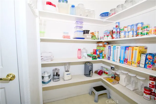 a kitchen with stainless steel appliances a refrigerator and a stove