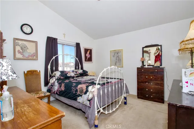 a bedroom with furniture and a chandelier