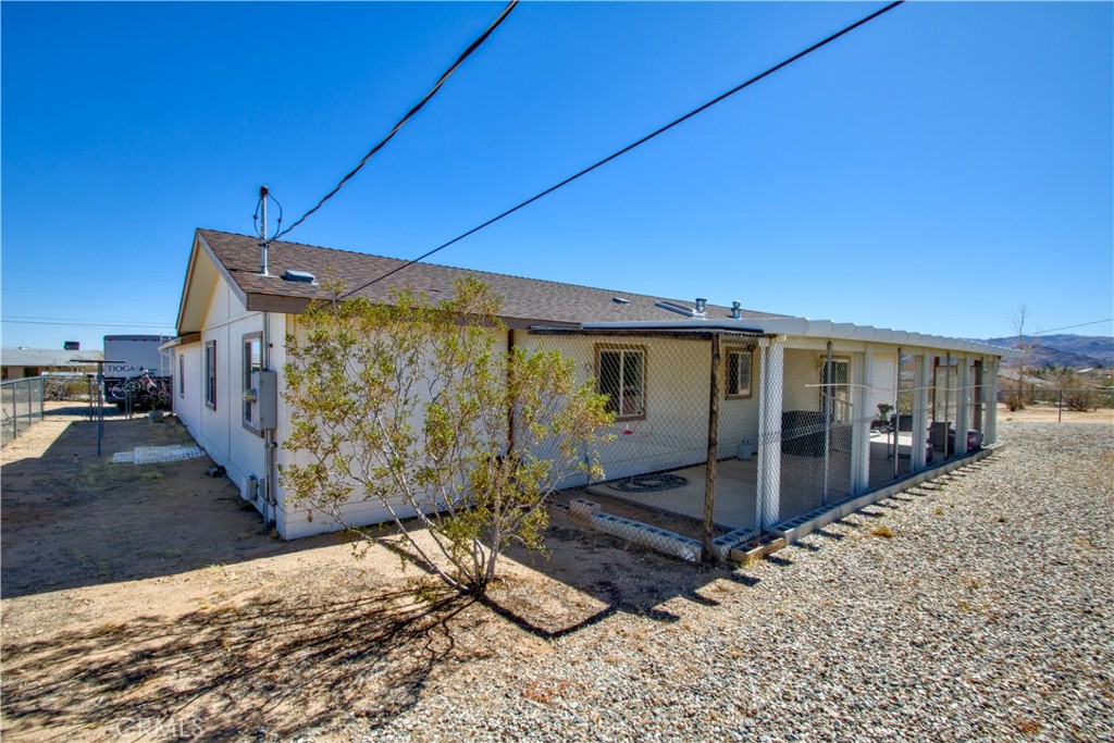4742 Avenida La Mirada Joshua Tree, CA 92252 - Photo 2 of 45 a view of a house with a snow in the background