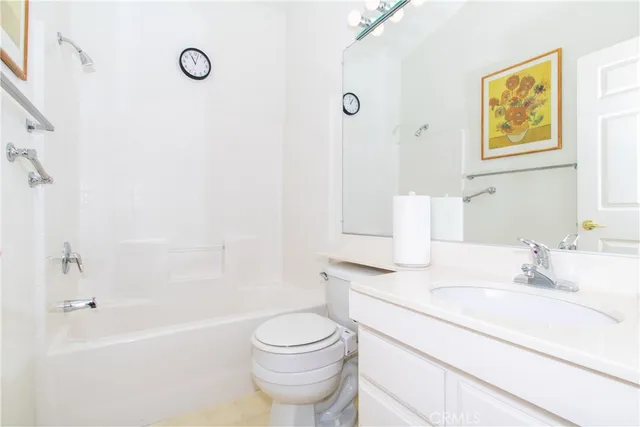 a bed room with a bed and a mirror