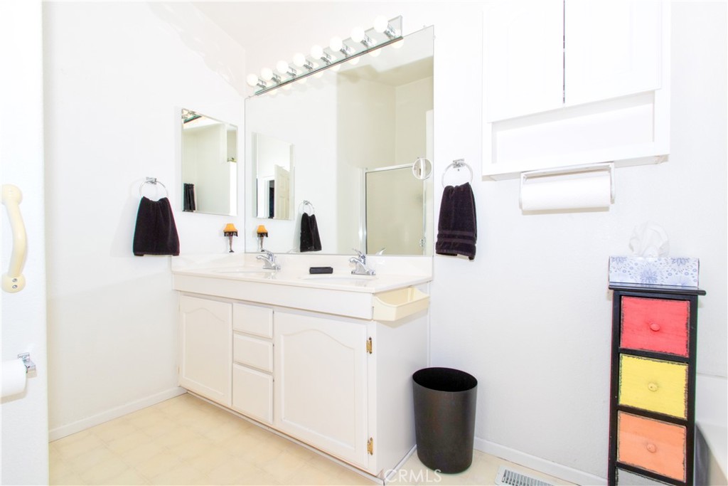 4742 Avenida La Mirada Joshua Tree, CA 92252 - Photo 26 of 45 a bathroom with a sink and a mirror