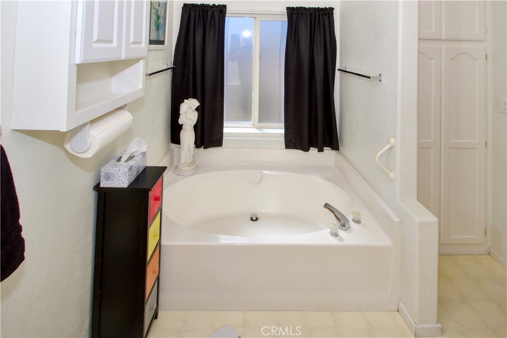 4742 Avenida La Mirada Joshua Tree, CA 92252 - Photo 27 of 45 a bathroom with a bathtub and shower