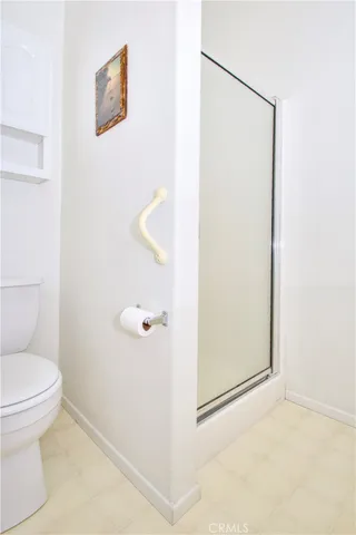 a utility room with cabinets washer and dryer