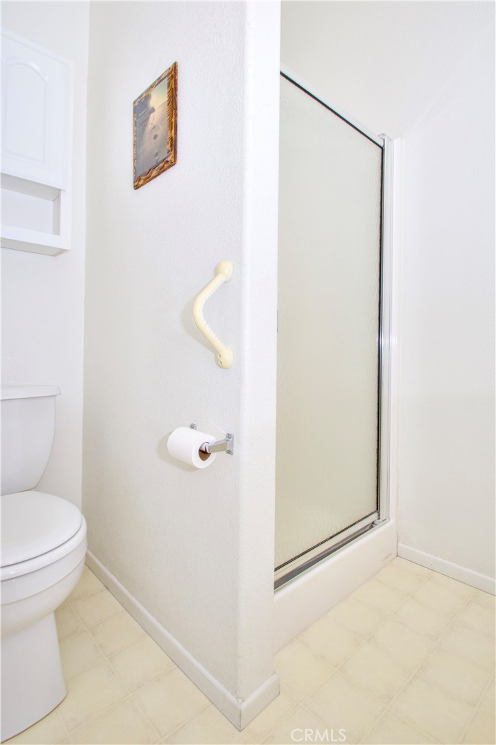 4742 Avenida La Mirada Joshua Tree, CA 92252 - Photo 28 of 45 a bathroom with a toilet and a shower