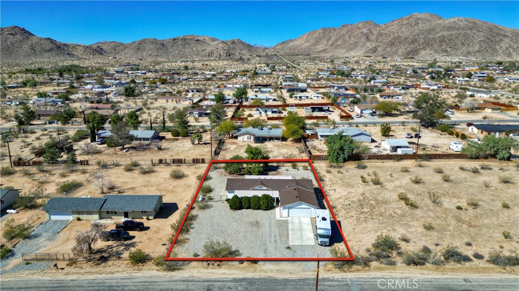 4742 Avenida La Mirada Joshua Tree, CA 92252 - Photo 36 of 45 an aerial view of residential houses with outdoor space
