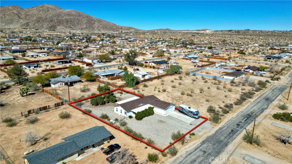 4742 Avenida La Mirada Joshua Tree, CA 92252 - Photo 37 of 45 an aerial view of residential houses with outdoor space