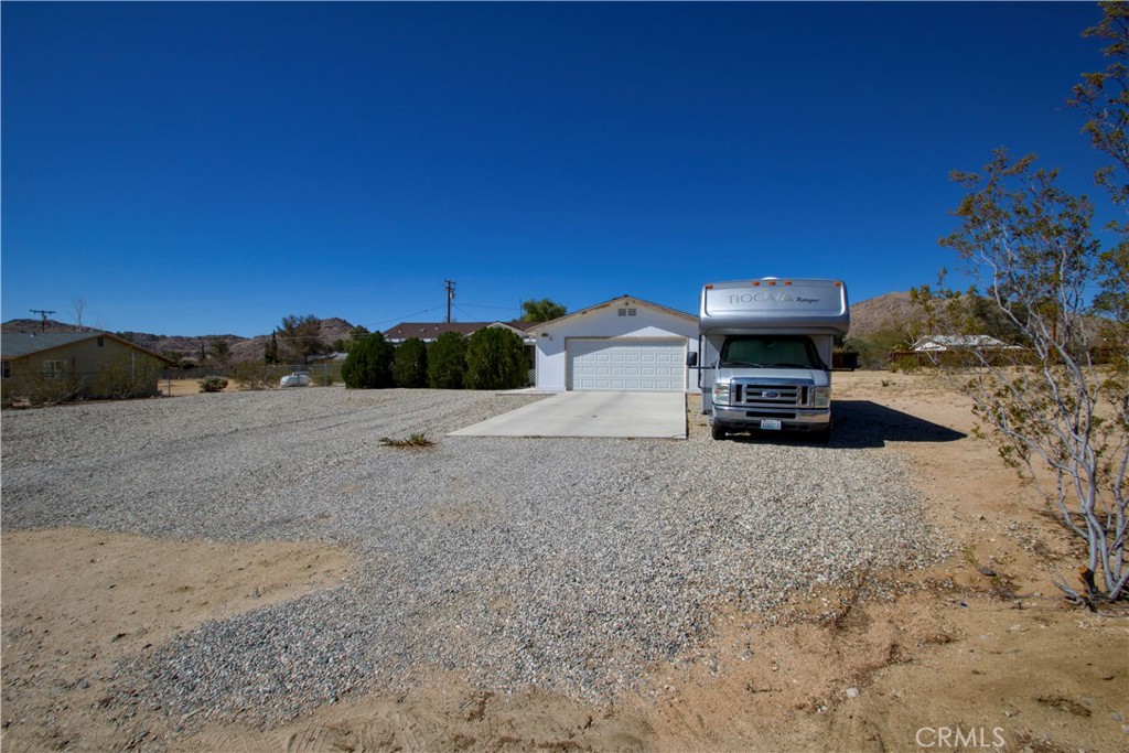 4742 Avenida La Mirada Joshua Tree, CA 92252 - Photo 43 of 45 a view of a house with a yard