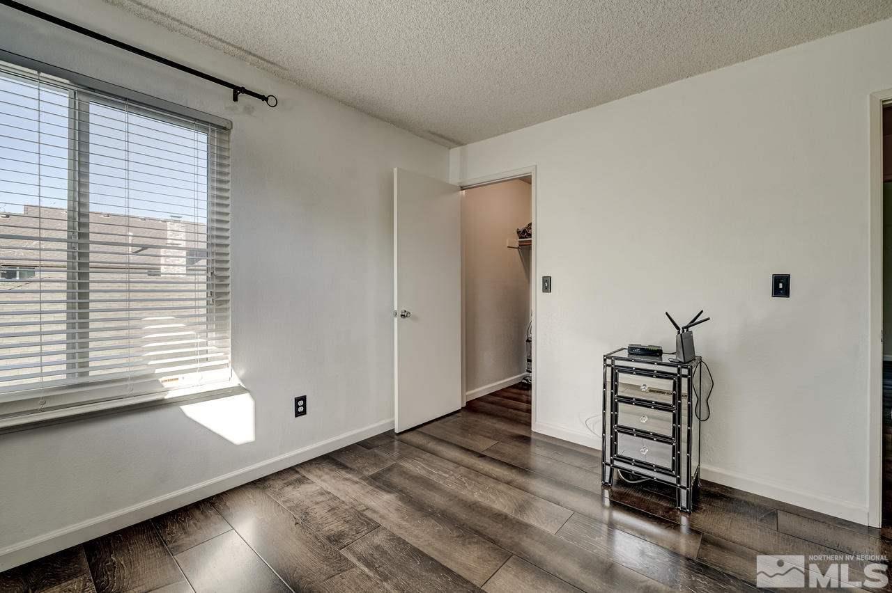 3812 Bexley Square Reno, NV 89503 - Photo 11 of 16 a view of a livingroom with a chair and a window