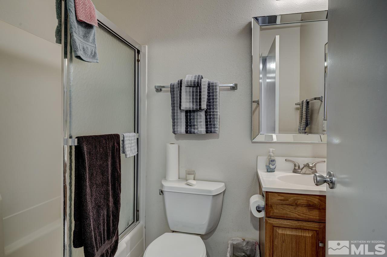 3812 Bexley Square Reno, NV 89503 - Photo 12 of 16 a bathroom with a toilet sink and mirror
