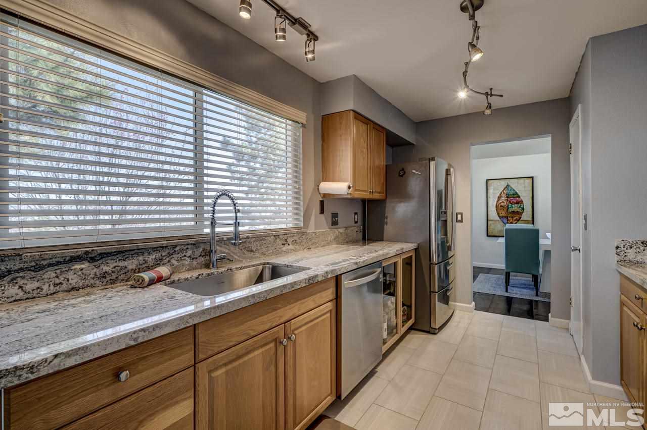 3812 Bexley Square Reno, NV 89503 - Photo 3 of 16 a kitchen with a sink and cabinets